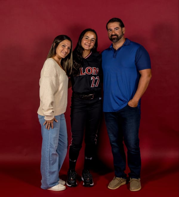 With her mom and dad in Elon #27