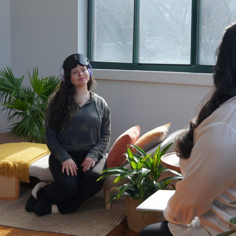 Two people talking in a real, comfortable room