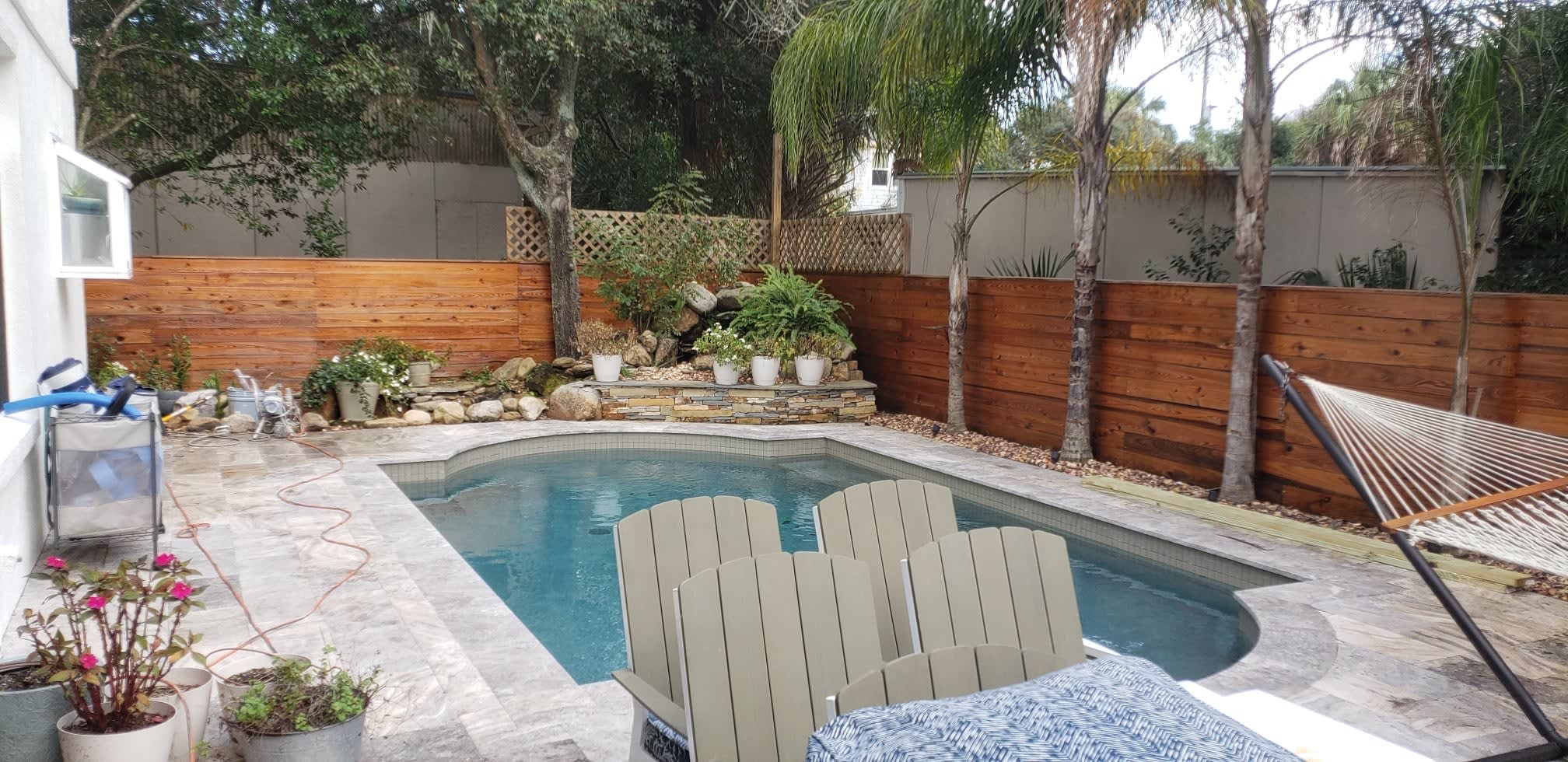 exterior pool with stained fence