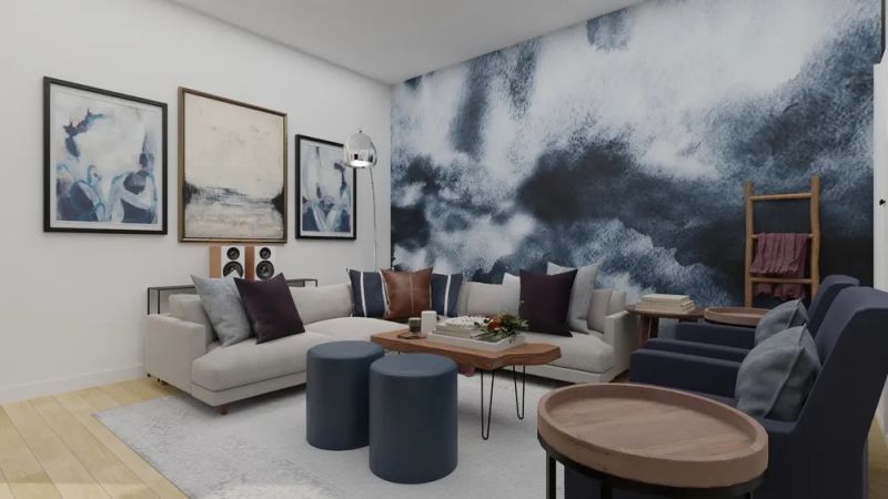 Living room with murals of blues and gallery wall designed by spacejoy