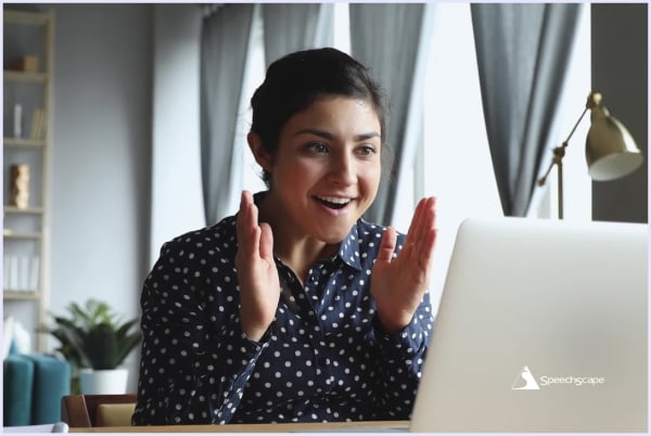 Surprised young woman at laptop. © 2025 SpeechScape™