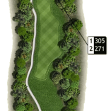 Overhead view of a hole on Gallagher's Canyon Canyon Course in Kelowna surrounded by trees, with a flagged distance marker indicating yardage.