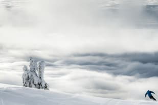A person downhill skiing at Big White Ski Resort