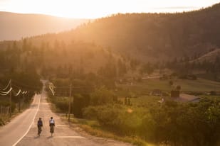 A couple cycling the backroads outside of Summerland