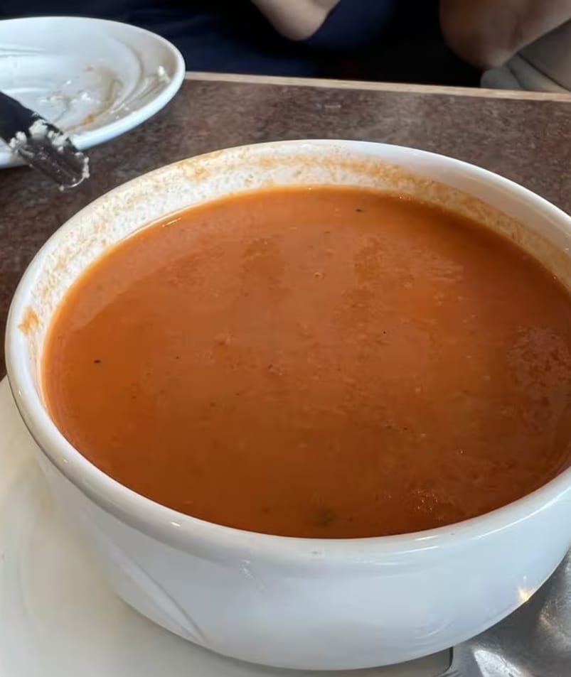 A bowl of tomato soup on a table at The Jammery in Lake Country.