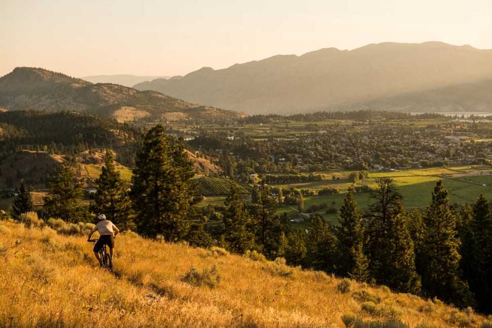 A mountain biker on a trail on Mount Conkle overlooking Summerland