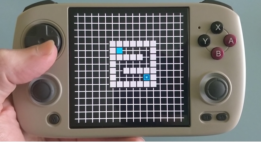 Handheld retro game console with a square screen displaying level 2 of my game-in-progress