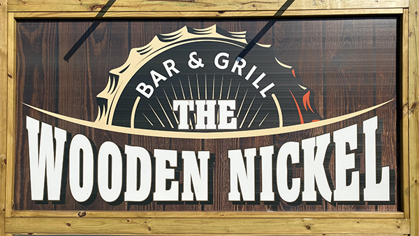 The Wooden Nickel Bar & Grill logo