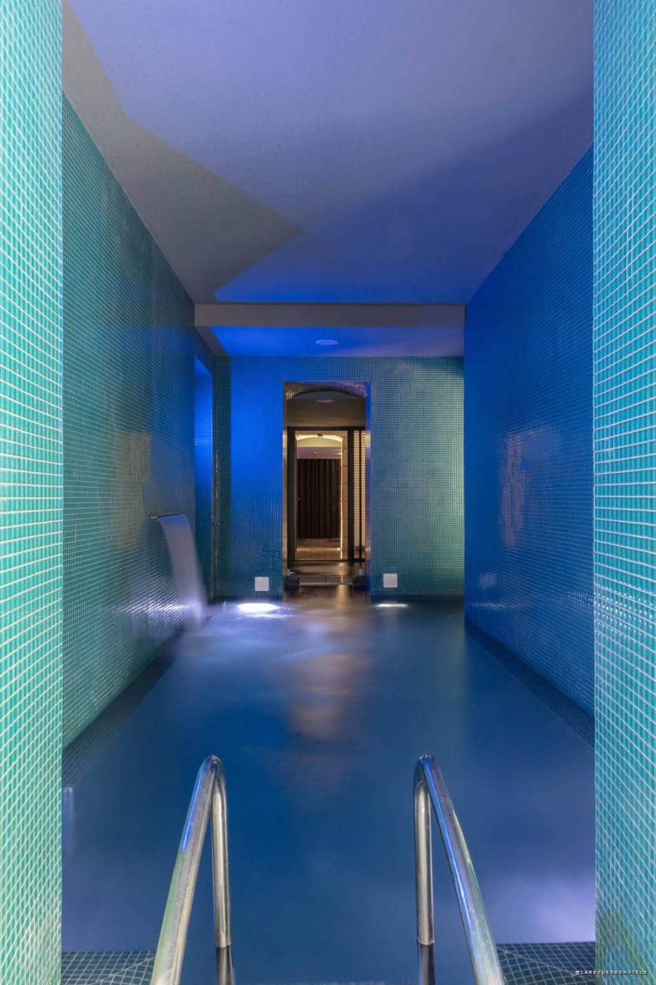 Heated indoor turquoise mosaic pool in the renovated spa at Hôtel C2 in Marseille