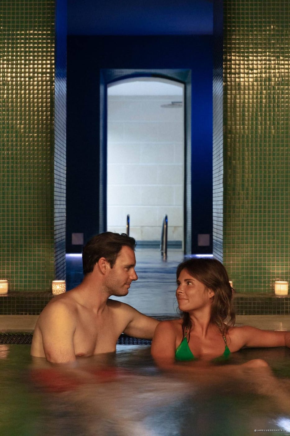 Green mosaic whirlpool bath at the Hôtel C2 spa