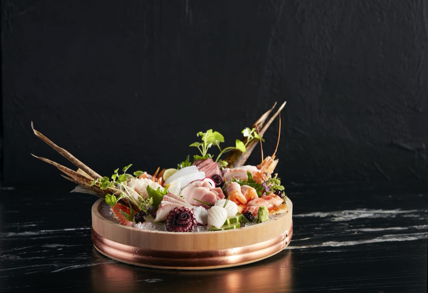 Sashimi platter in a copper-banded tub