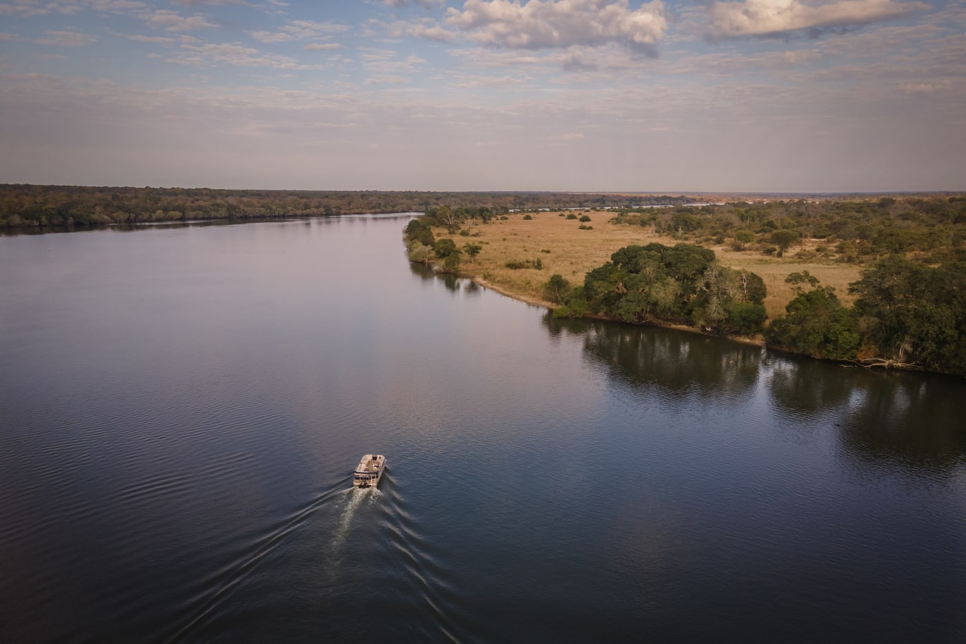 River safari boat on the Kafue River in Kafue National Park near Anantara Tented Camp Kafue River