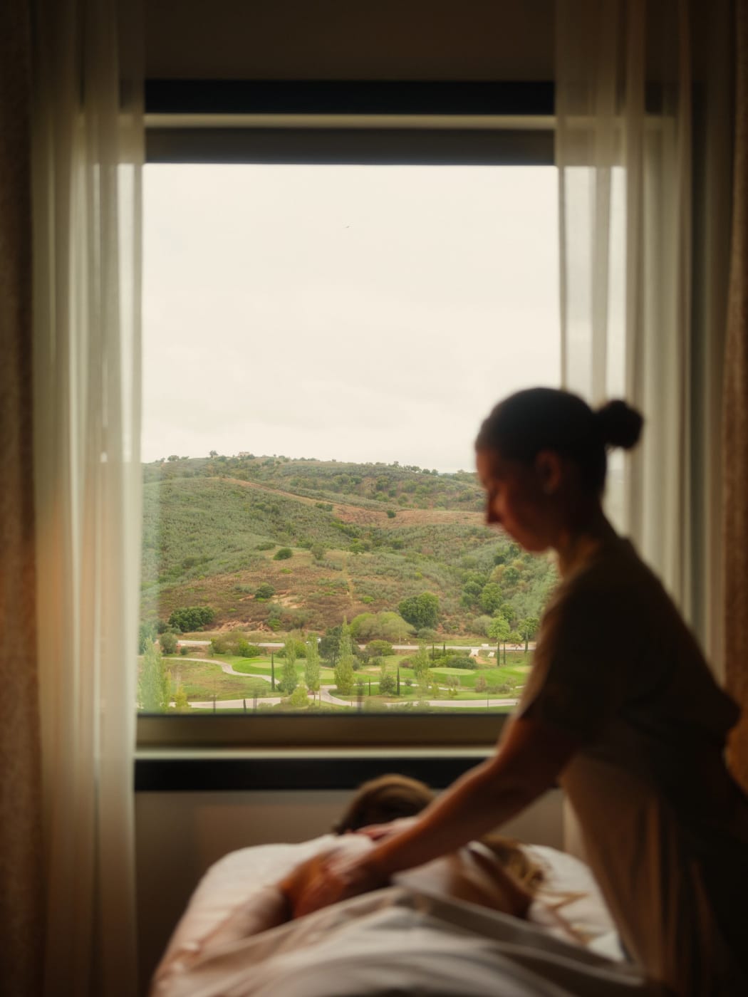 Massage in front of a window open to the hills at the Viceroy at Ombria Algarve spa