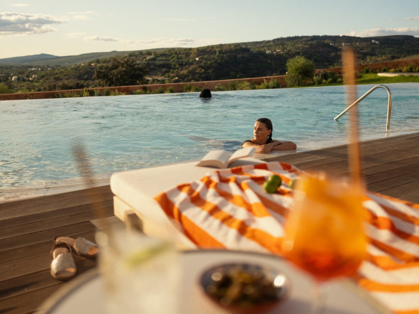 Infinity pool at Viceroy at Ombria Algarve facing the wooded hills of Loulé