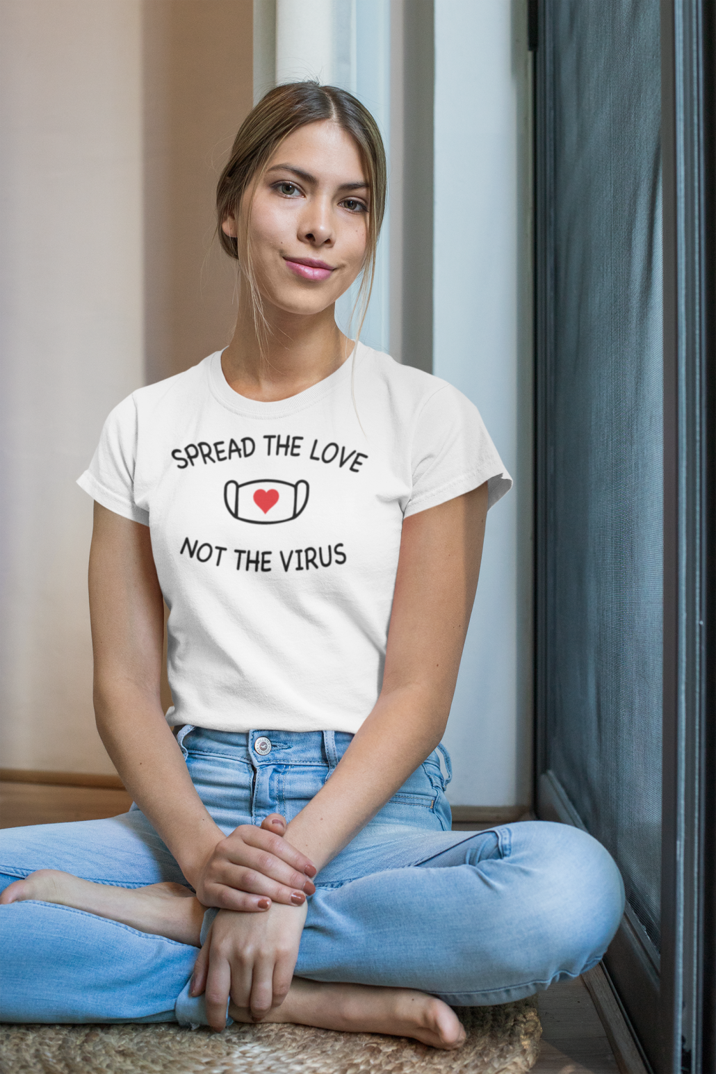 woman wearing personalized t-shirt and sitting at the window