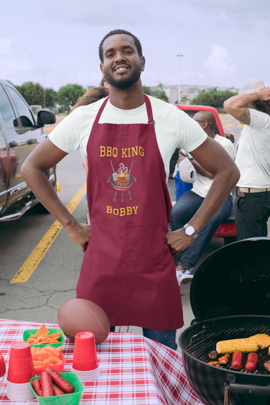 Black man with custom BBQ apron