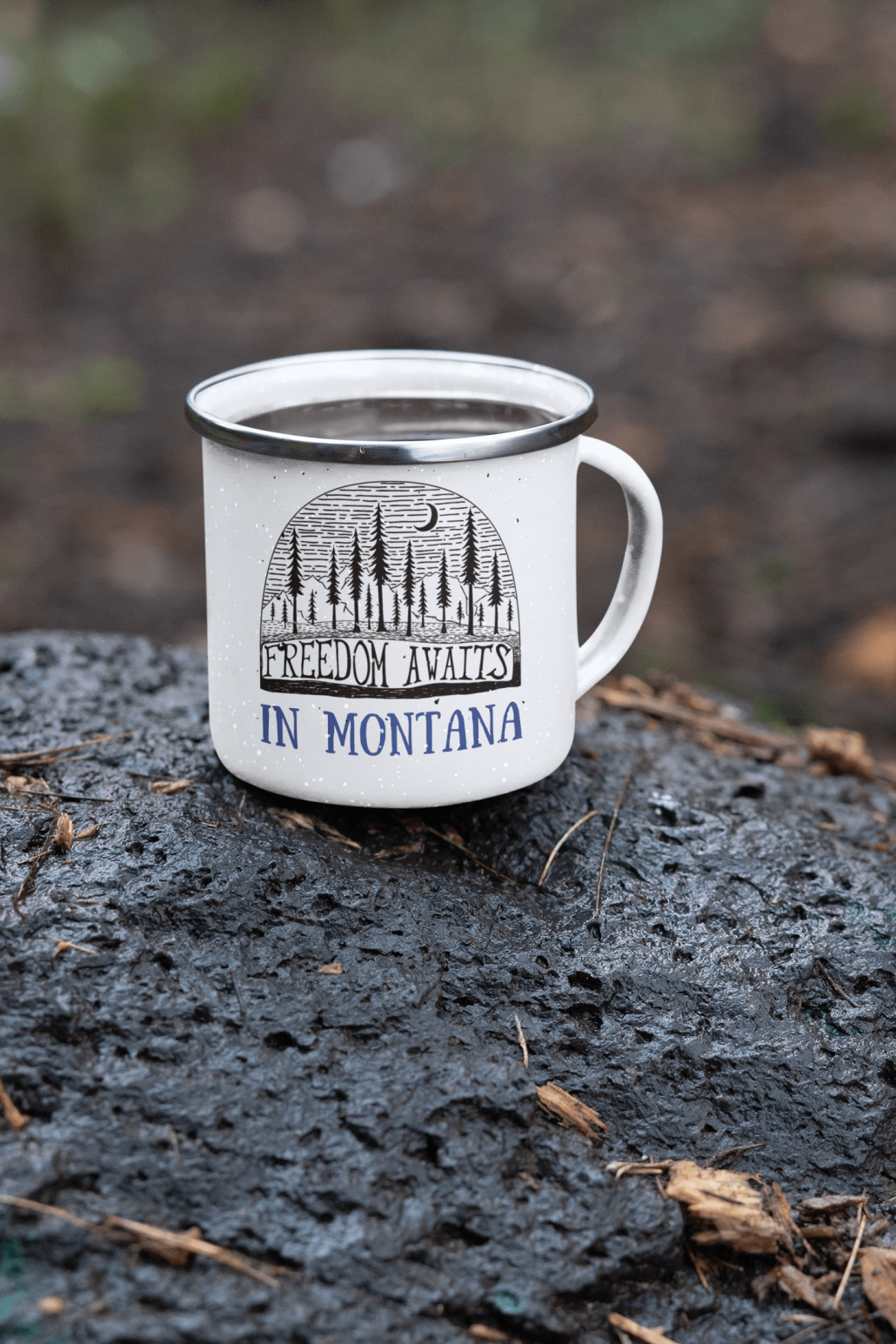 Custom camping mug on a stone in the wild