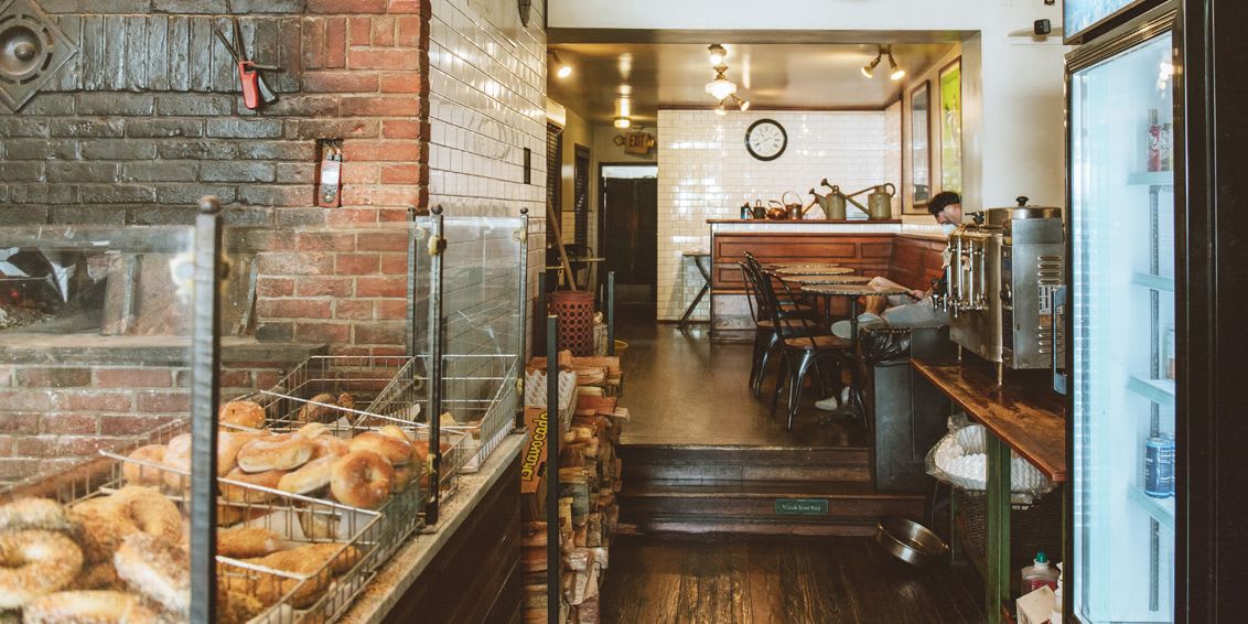 A picture of some bagels and the seating area at our Rittenhouse Spread Bagelry Location.