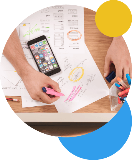 Two hands dealing with insurance papers on a desk