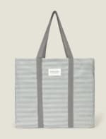 Bolso playa algodón con rayas brillo por 13.99€.