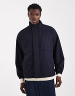 ASOS DESIGN chaqueta de chándal azul marino por 14.90€