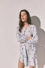 Women'Secret Camisola corta rayas palmeras por 12.59€.