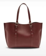 Bolso shopper perforado con bolso por 17.99€.