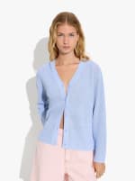 Cardigan de punto con cordón ajustable por 12.99€.