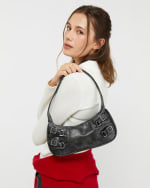 Bolso de hombro pequeño gris por 9€.