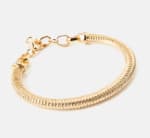 Pulsera Heritage dorada por 3,85€.