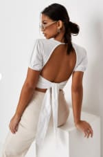 White puff sleeve open back crop top for £12.80.