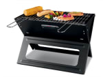 Barbacoa plegable con asa de transporte integrada y parrilla de acero cromado con dos asas desmontables por 17.99€
