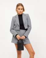 Bolso Bandolera mini para móvil con detalles metálicos por 6€