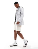 Chubasquero ASOS DESIGN gris engomado por 10,80€