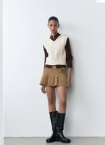 Chaleco punto trenzado capucha por 7.99€