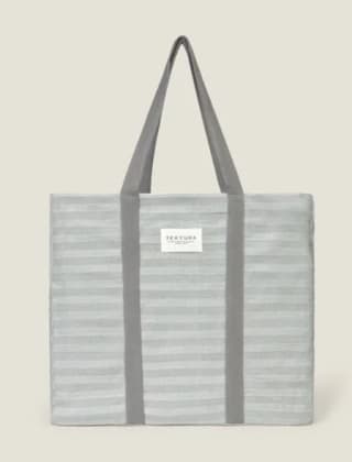 Bolso playa algodón con rayas brillo por 13.99€.