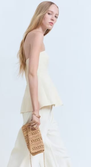 Bolso mano fibra natural anillas metálicas por 19.99€