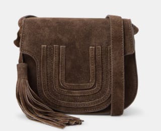 Bandolera de piel con pompón Tintoretto por 27.6€