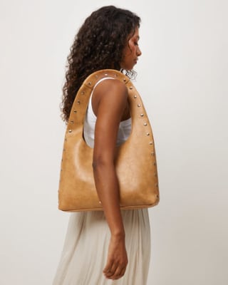Bolso hobo grande con detalles metálicos por 22€