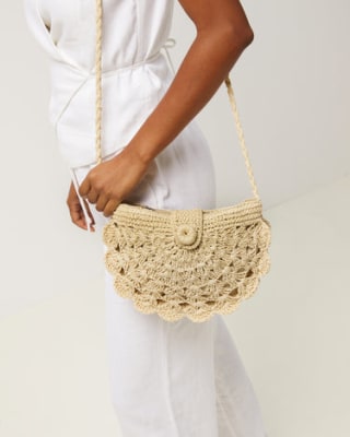 Bolso bandolera media luna efecto rafia por 22€