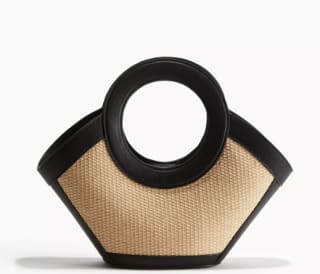 Cartera de paja con detalles revestidos por $18.743