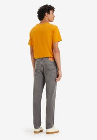 Levi's grijze 515 slim taper herenjeans voor €27,95 bij Zalando