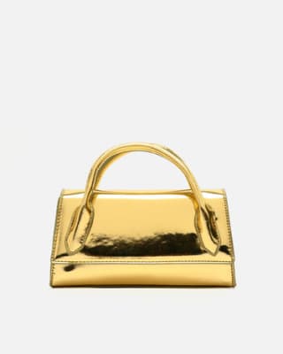 Bolso de mano de fiesta con bandolera extraíble y acabado metalizado por 9€.