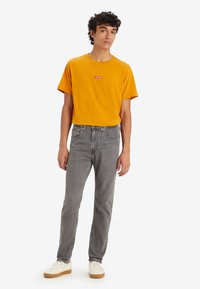 Levi's grijze 515 slim taper herenjeans voor €27,95 bij Zalando