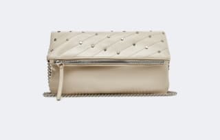 Bolso metálico Tachas color beige por 4,99€.