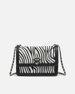 Bolso bandolera de fiesta con estampado animal print por 12€