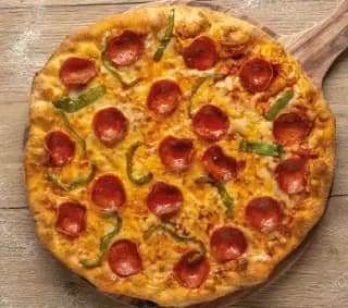 Pizza mediana con 2 ingredientes para recoger en Pizzería Carlos por 6,95€