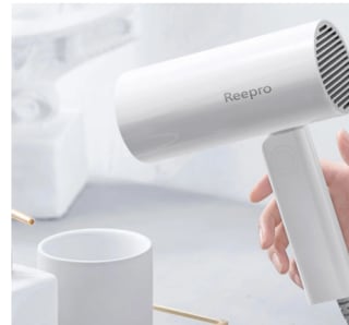 secador de pelo eléctrico de iones negativos portátil y plegable, 1300W por 16,85€