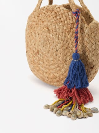 Bolso Bandolera de rafia por 5,99€.