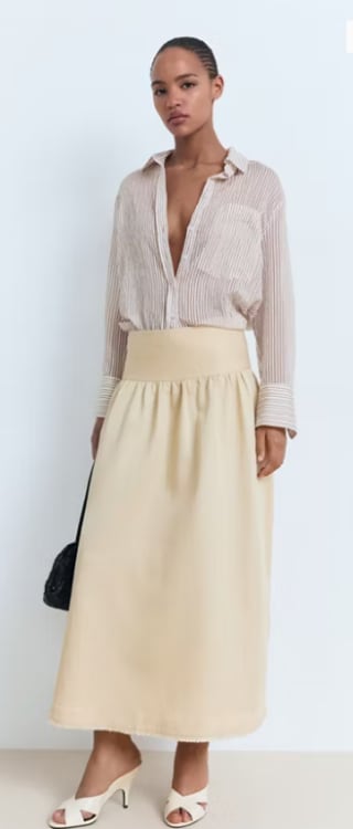 Falda midi terminaciones deshilachadas por 7.99€